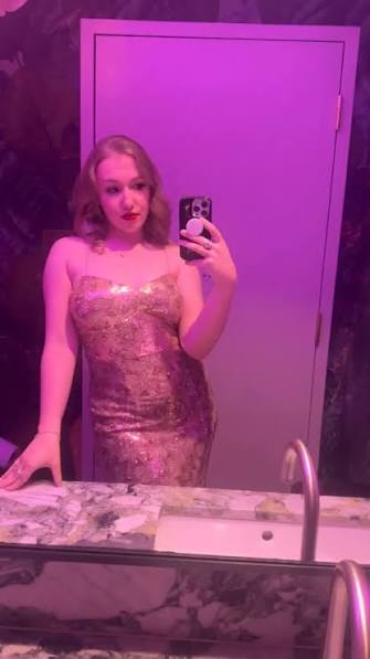 Coco in a gold sequin gown
